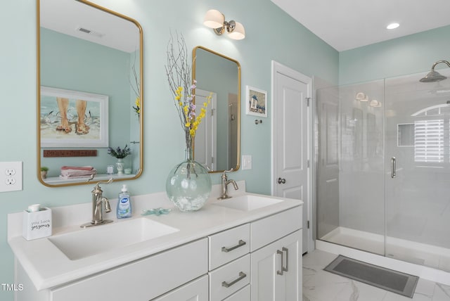 210 Meadow Lake Dr, Youngsville, NC 27596 - bathroom featuring a shower stall, double vanity, marble finish flooring, and recessed lighting