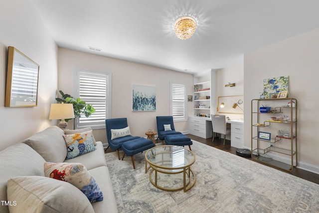 210 Meadow Lake Dr, Youngsville, NC 27596 - living area with dark wood-style flooring and built in study area