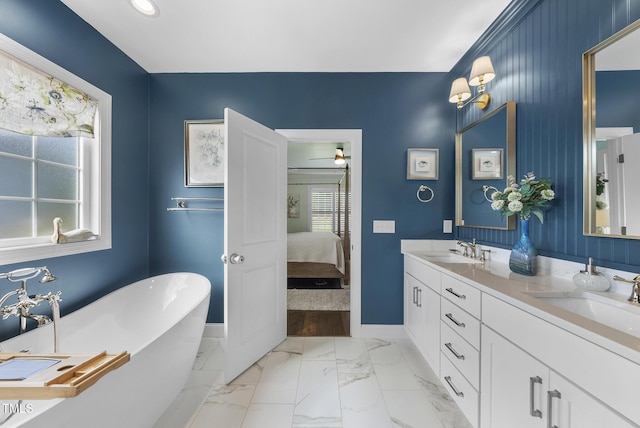 210 Meadow Lake Dr, Youngsville, NC 27596 - full bathroom with a freestanding tub, ensuite bath, double vanity, marble look tiles, and recessed lighting