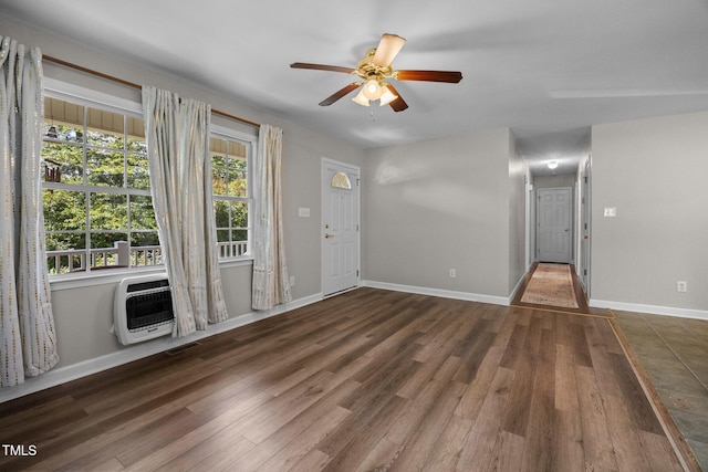 270 Ballard Pruitt Rd, Franklinton, NC 27525 - unfurnished living room featuring heating unit, a ceiling fan, and wood finished floors