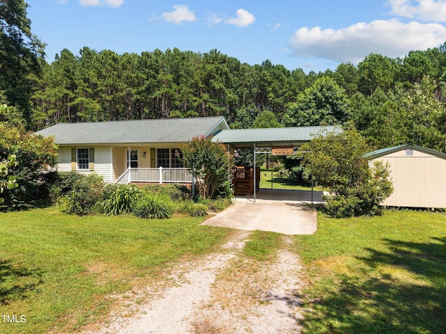 270 Ballard Pruitt Rd, Franklinton, NC 27525 - single story home featuring a porch, dirt driveway, a front lawn, and a wooded view