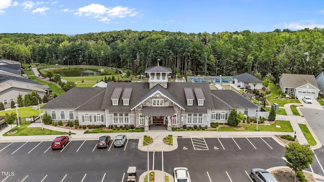 113 Canary Ct, Raleigh, NC 27610 - view of property featuring uncovered parking, a water view, and a view of trees