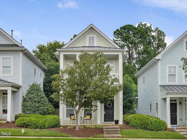 7712 Acc Blvd, Raleigh, NC 27617 - view of front of property featuring a standing seam roof and a metal roof