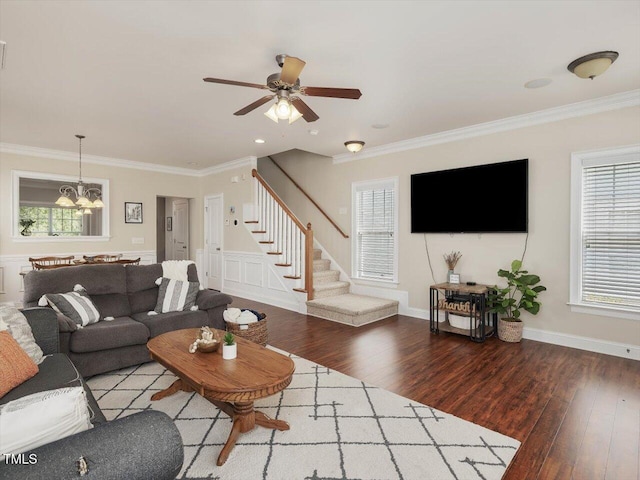 7712 Acc Blvd, Raleigh, NC 27617 - living area featuring wood finished floors, stairway, crown molding, a chandelier, and a ceiling fan