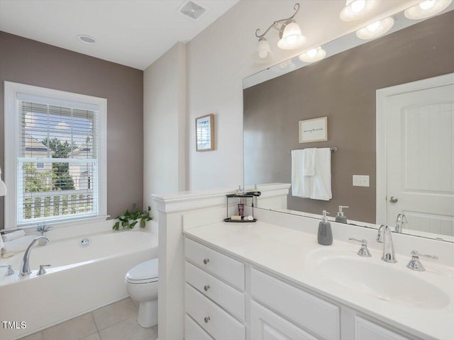 7712 Acc Blvd, Raleigh, NC 27617 - full bathroom with healthy amount of natural light, vanity, a garden tub, and tile patterned floors