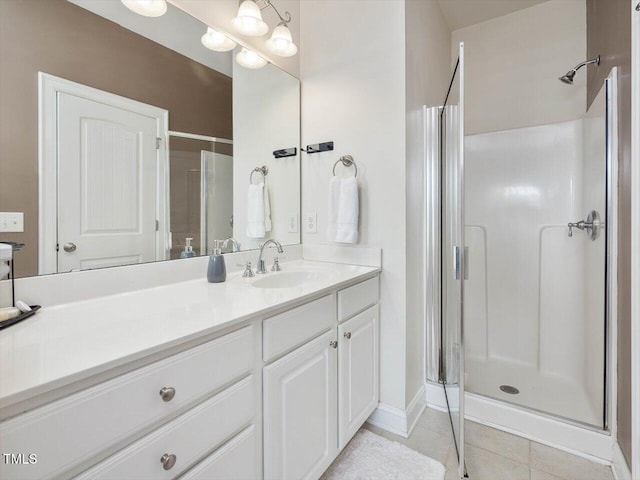 7712 Acc Blvd, Raleigh, NC 27617 - bathroom featuring a stall shower, vanity, and tile patterned floors