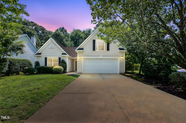 2304 Folger St, Raleigh, NC 27604 - traditional home with a garage, concrete driveway, and a front lawn