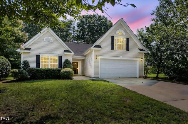 2304 Folger St, Raleigh, NC 27604 - traditional-style house featuring an attached garage, driveway, and a lawn