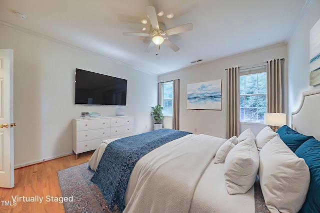 2304 Folger St, Raleigh, NC 27604 - bedroom with crown molding, light wood-type flooring, and a ceiling fan