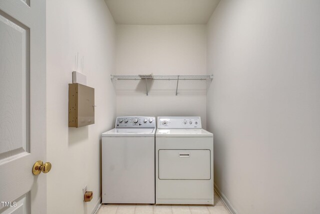 2304 Folger St, Raleigh, NC 27604 - washroom featuring separate washer and dryer and light tile patterned flooring