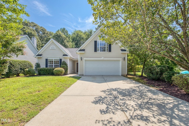 2304 Folger St, Raleigh, NC 27604 - traditional-style house with driveway, a garage, and a front yard