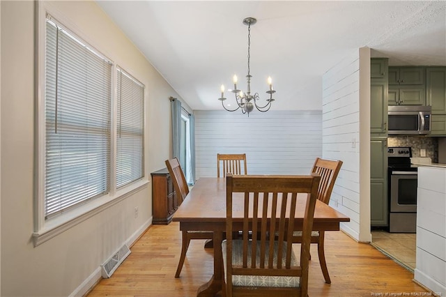 1828 Notre Dame Pl, Fayetteville, NC 28304 - dining area with a chandelier and light wood finished floors
