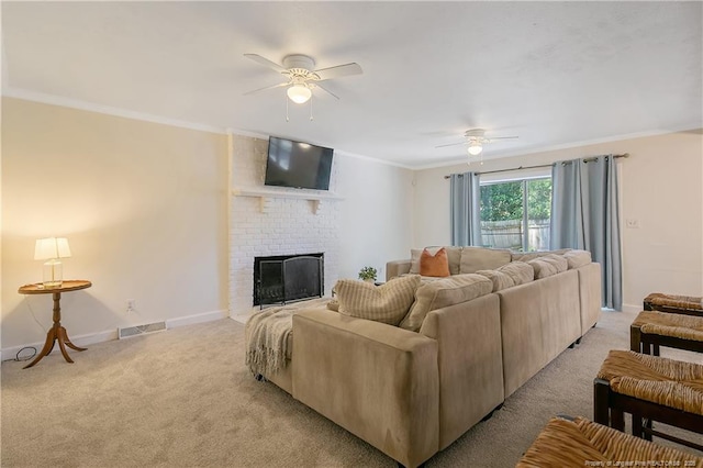 1828 Notre Dame Pl, Fayetteville, NC 28304 - living room featuring a ceiling fan, light colored carpet, ornamental molding, and a fireplace