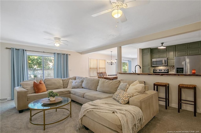1828 Notre Dame Pl, Fayetteville, NC 28304 - living room with ceiling fan, a chandelier, and light carpet