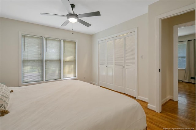 1828 Notre Dame Pl, Fayetteville, NC 28304 - unfurnished bedroom with multiple windows, light wood-type flooring, a closet, and a ceiling fan