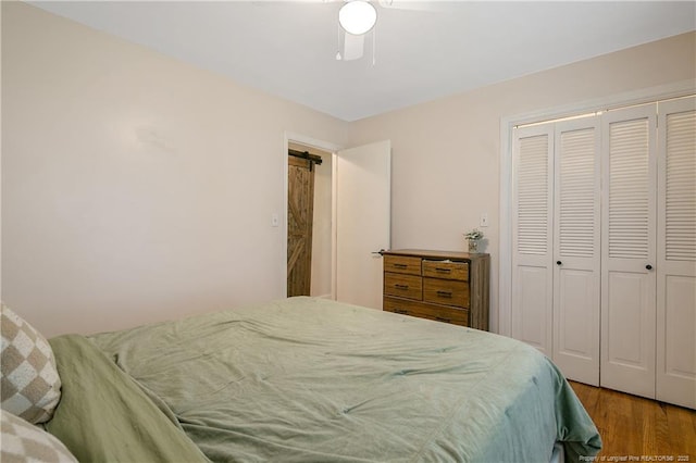 1828 Notre Dame Pl, Fayetteville, NC 28304 - bedroom with wood finished floors, a closet, and a ceiling fan