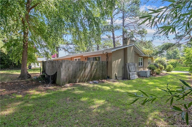 1828 Notre Dame Pl, Fayetteville, NC 28304 - view of side of property with stucco siding and a chimney