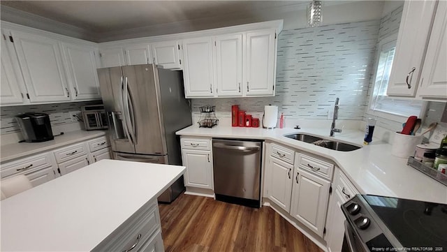 2508 N Roberts Ave N, Lumberton, NC 28358 - kitchen with stainless steel appliances, white cabinets, light countertops, and dark wood-style floors