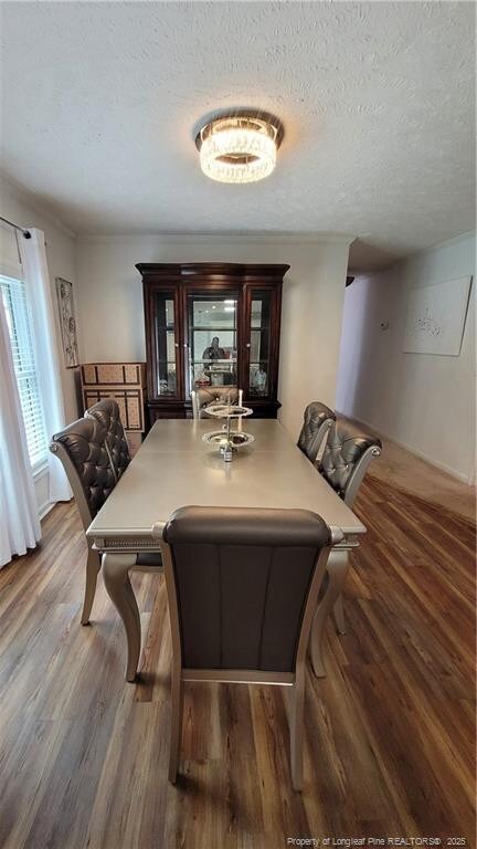 2508 N Roberts Ave N, Lumberton, NC 28358 - dining area featuring a textured ceiling and wood finished floors