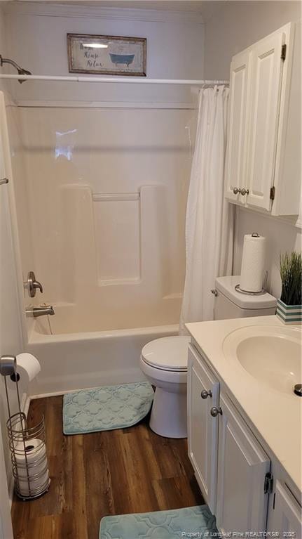 2508 N Roberts Ave N, Lumberton, NC 28358 - bathroom with wood finished floors, vanity, shower / bath combination with curtain, and ornamental molding