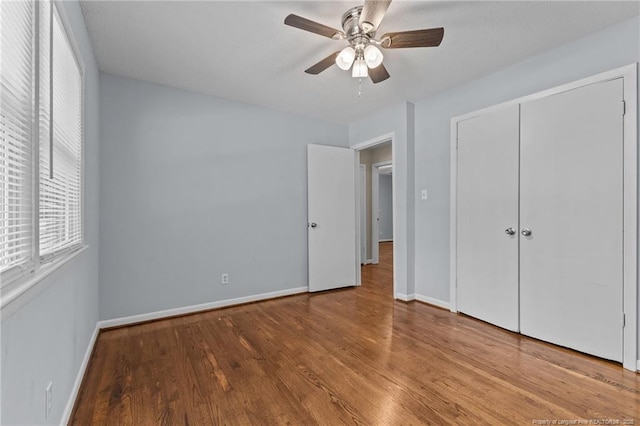521 Fawn Ct, Fayetteville, NC 28303 - unfurnished bedroom featuring wood finished floors, a ceiling fan, and a closet
