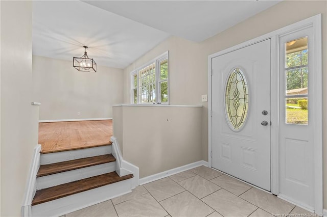 521 Fawn Ct, Fayetteville, NC 28303 - foyer entrance with a chandelier and stairway