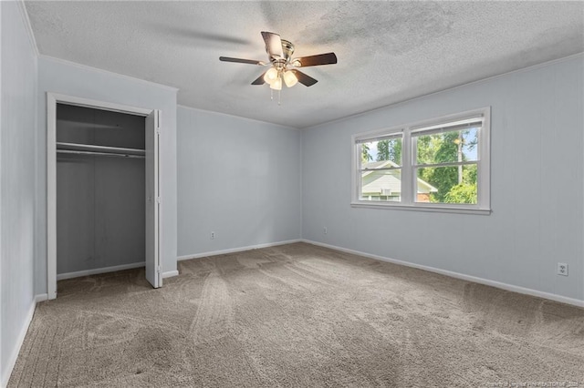 521 Fawn Ct, Fayetteville, NC 28303 - unfurnished bedroom with carpet, a textured ceiling, a closet, and a ceiling fan