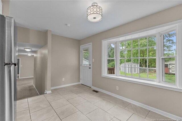 521 Fawn Ct, Fayetteville, NC 28303 - foyer featuring light tile patterned floors and baseboards