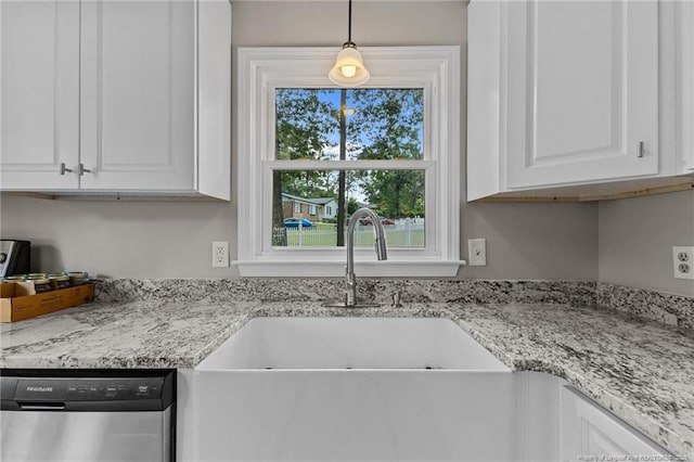 521 Fawn Ct, Fayetteville, NC 28303 - kitchen featuring stainless steel dishwasher, white cabinetry, light stone countertops, and hanging light fixtures