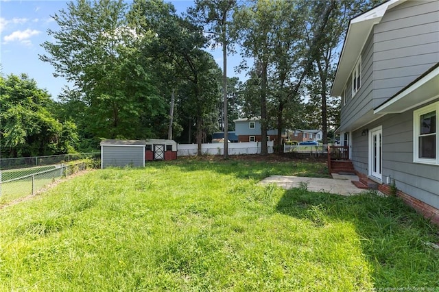 521 Fawn Ct, Fayetteville, NC 28303 - fenced backyard featuring a patio and a shed