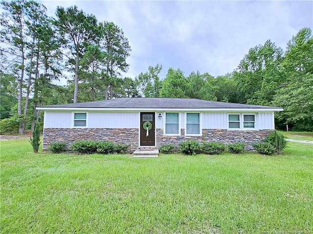 7246 Faircloth Bridge Rd, Stedman, NC 28391 - single story home featuring stone siding and a front lawn