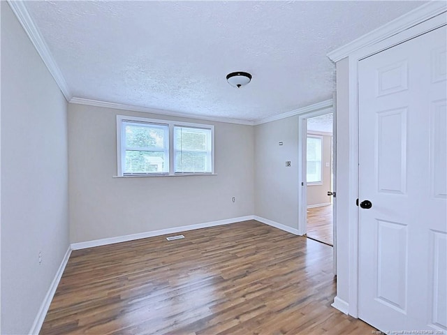 7246 Faircloth Bridge Rd, Stedman, NC 28391 - unfurnished room with wood finished floors, a textured ceiling, and ornamental molding