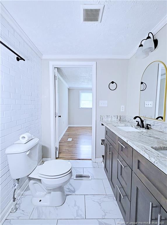 7246 Faircloth Bridge Rd, Stedman, NC 28391 - full bath featuring ornamental molding, double vanity, marble look tile flooring, and a textured ceiling