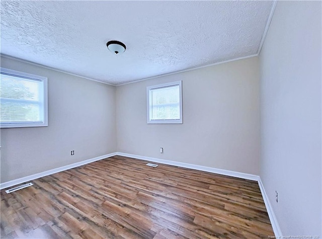 7246 Faircloth Bridge Rd, Stedman, NC 28391 - unfurnished room featuring wood finished floors and a textured ceiling