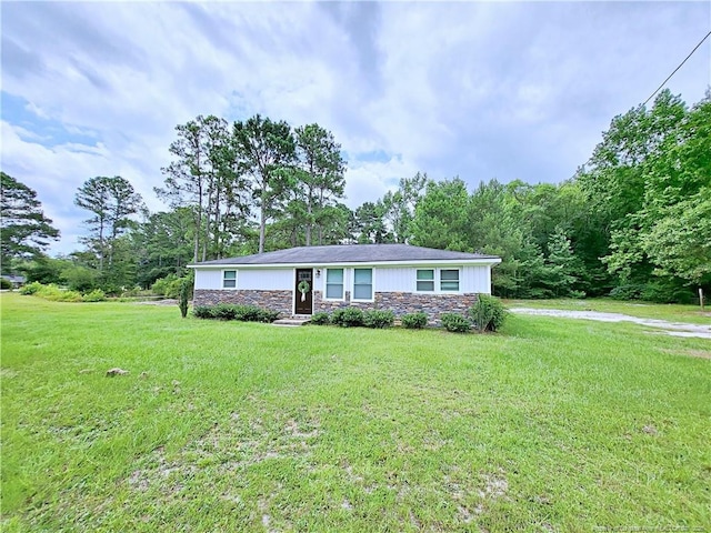 7246 Faircloth Bridge Rd, Stedman, NC 28391 - single story home featuring stone siding and a front yard