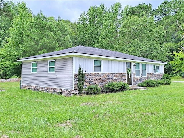 7246 Faircloth Bridge Rd, Stedman, NC 28391 - view of front of property with a front lawn and stone siding