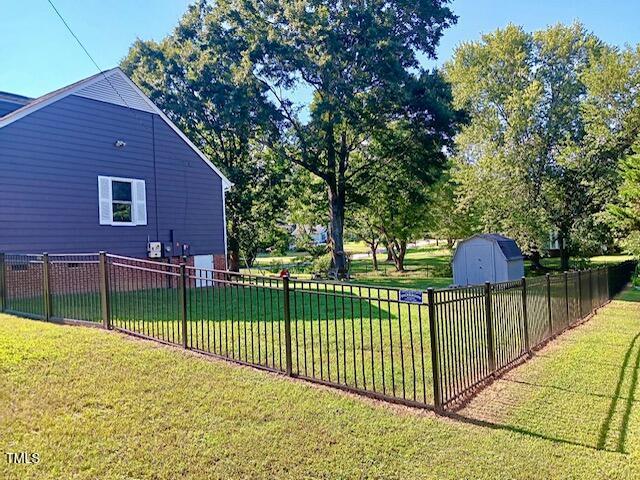 105 Meadow Brook Ln, Oxford, NC 27565 - fenced backyard featuring a storage shed