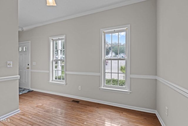 108 Tarlow Ct, Cary, NC 27513 - spare room featuring healthy amount of natural light, hardwood / wood-style flooring, and ornamental molding