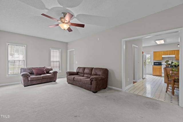 108 Tarlow Ct, Cary, NC 27513 - living room with light carpet and a ceiling fan