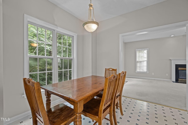 108 Tarlow Ct, Cary, NC 27513 - dining space with a fireplace with flush hearth and light colored carpet