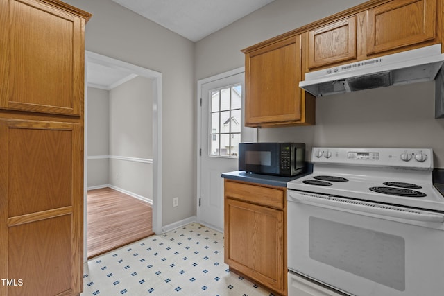 108 Tarlow Ct, Cary, NC 27513 - kitchen with white electric stove, under cabinet range hood, black microwave, and brown cabinetry