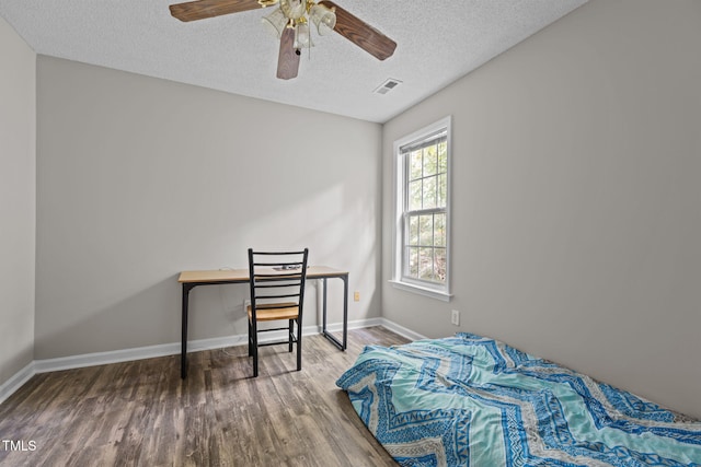 108 Tarlow Ct, Cary, NC 27513 - bedroom featuring wood finished floors, a textured ceiling, and ceiling fan