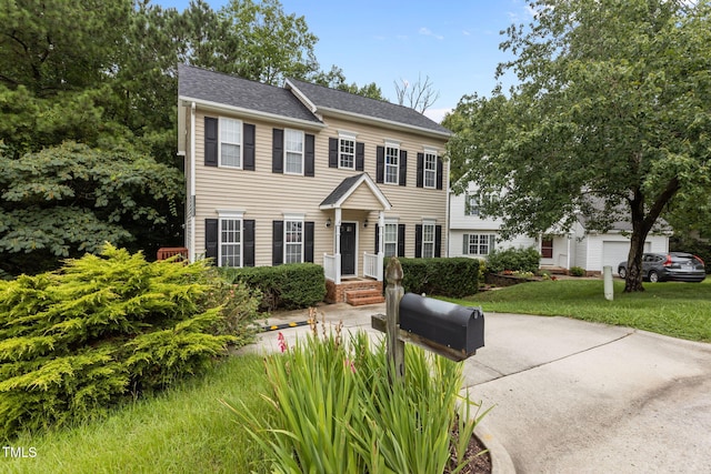 108 Tarlow Ct, Cary, NC 27513 - colonial inspired home featuring a front yard and a shingled roof