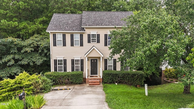 108 Tarlow Ct, Cary, NC 27513 - colonial home with roof with shingles and a front yard