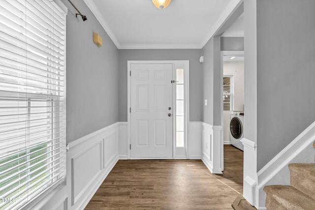 2127 Rivergrass Ct, Raleigh, NC 27610 - entrance foyer with washer / clothes dryer, wood finished floors, stairway, crown molding, and a wainscoted wall