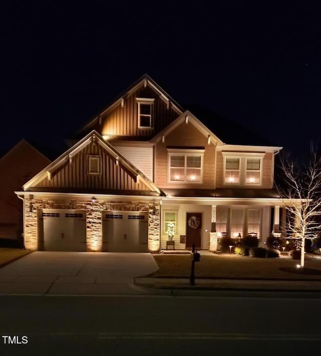 6004 Stony Falls Way, Knightdale, NC 27545 - craftsman inspired home featuring board and batten siding, stone siding, driveway, a garage, and a porch