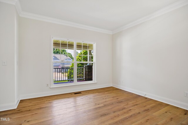 80 Clubhouse Dr, Youngsville, NC 27596 - unfurnished room featuring crown molding and hardwood / wood-style flooring