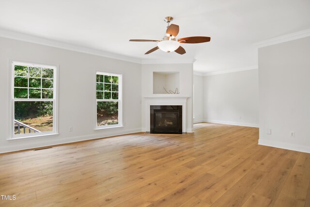 80 Clubhouse Dr, Youngsville, NC 27596 - unfurnished living room featuring a ceiling fan, crown molding, light wood-type flooring, and a fireplace with flush hearth