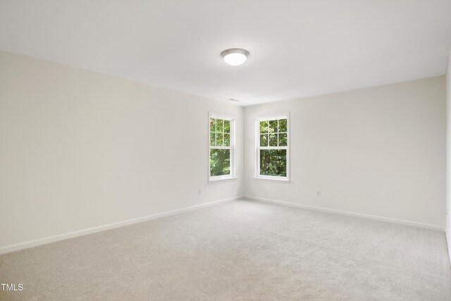 80 Clubhouse Dr, Youngsville, NC 27596 - unfurnished room featuring light colored carpet and baseboards