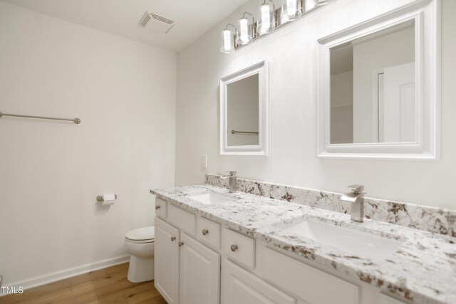 80 Clubhouse Dr, Youngsville, NC 27596 - full bathroom with double vanity and wood finished floors